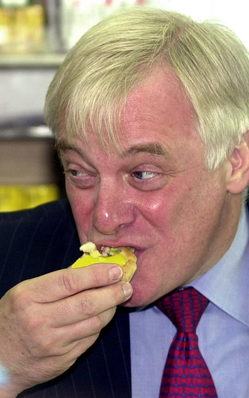 Lord Patten tastes an egg tart at his favourite Hong Kong bakery, three years after the 1997 handover - Credit: AP/ VINCENT YU