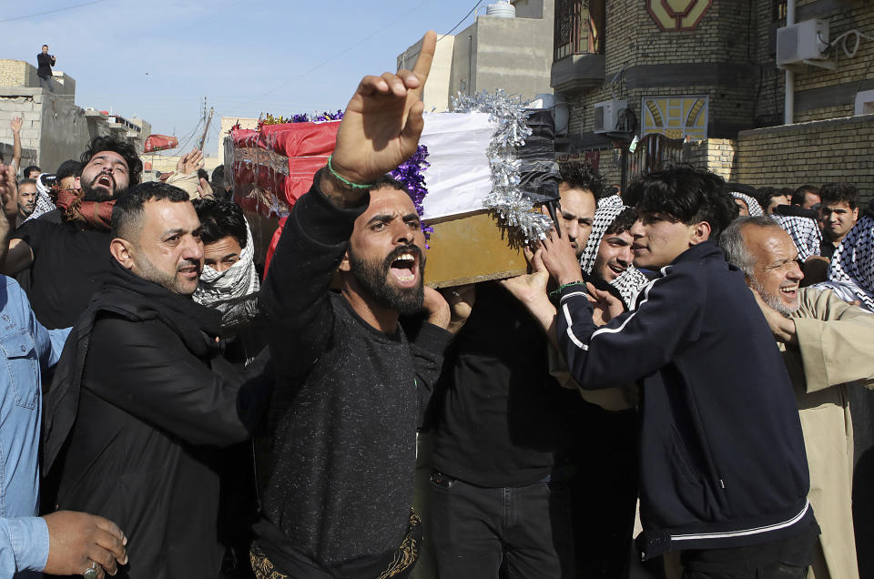 Mourners carry a coffin of prominent social activist Wissam al-Ghrawi in Basra, Iraq, Sunday, Nov. 18, 2018. Iraqi police say religious cleric Wissam, who was linked to the ongoing protests over poor services in Basra, was killed outside his home after suggested that demonstrators should take up arms over the conditions in the city. (AP Photo/Nabil al-Jurani)