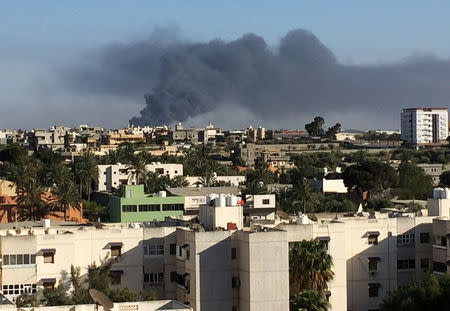 Smoke rises during a fight between members of the Libyan internationally recognised government forces and Eastern forces in Ain Zara, Tripoli, Libya May 5, 2019. REUTERS/Ayman al-Sahili