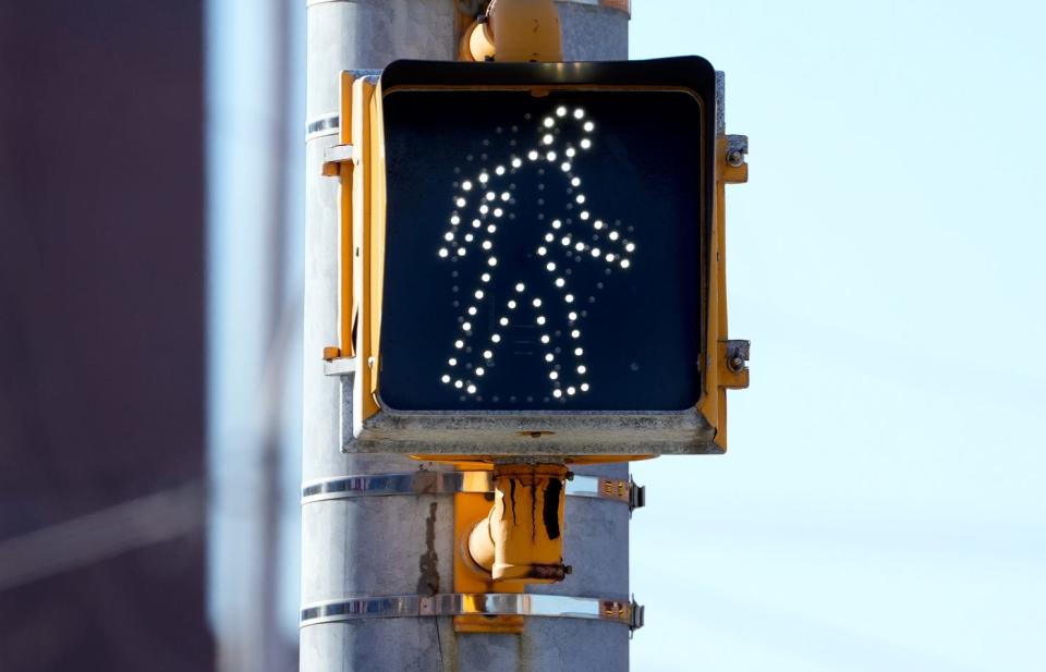A walk signal along North Main Street tells pedestrians when it's safe to cross.