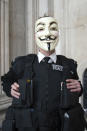 Demonstrator wearing anonymous V For Vendetta Guy Fawkes mask and 'Metropolitan Peace' uniform - London, 16 October.