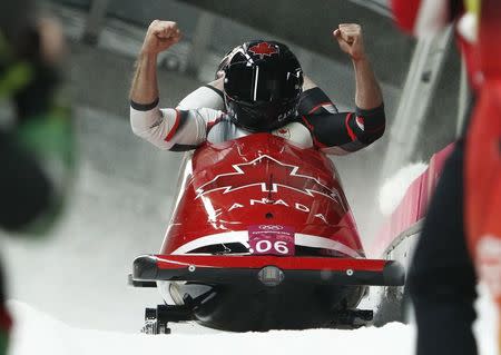 Bobsleigh - Pyeongchang 2018 Winter Olympics - Men's 2-man Finals - Olympic Sliding Centre - Pyeongchang, South Korea - February 19, 2018 - Alexander Kopacz and Justin Kripps of Canada react. REUTERS/Edgar Su