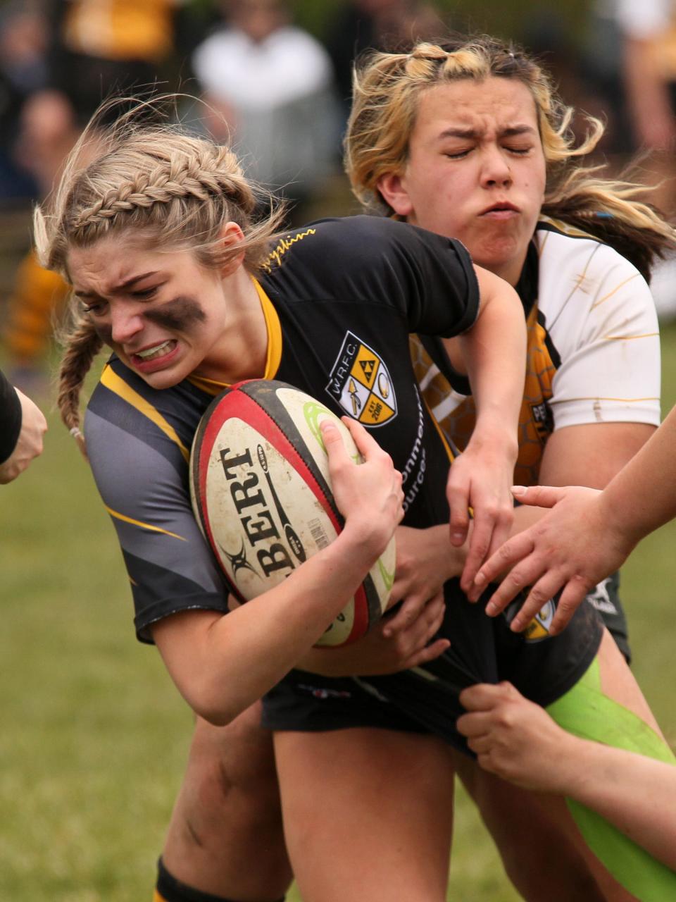 Maddi VanHoose tries to break a tackle for Warrior Rugby during a 42-12 victory over Perrysburg on Sunday.