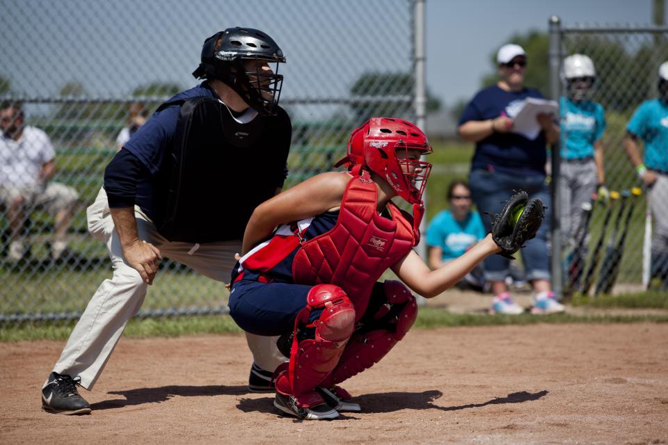 Heather Jacobs, 13, plays as catcher during a Fort Gratiot Little League 12U Father's Day softball tournament Saturday, June 20, 2015 in Fort Gratiot.