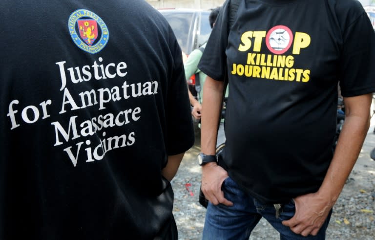 Filipino journalists rally outside a jail faclility, where a special court is trying members of the powerful Ampatuan clan for the political massacre of 58 people, in Manila on November 17, 2010
