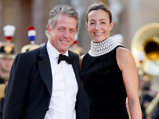 <p>LUDOVIC MARIN/AFP/Getty</p> Hugh Grant and Anna Ebersetin