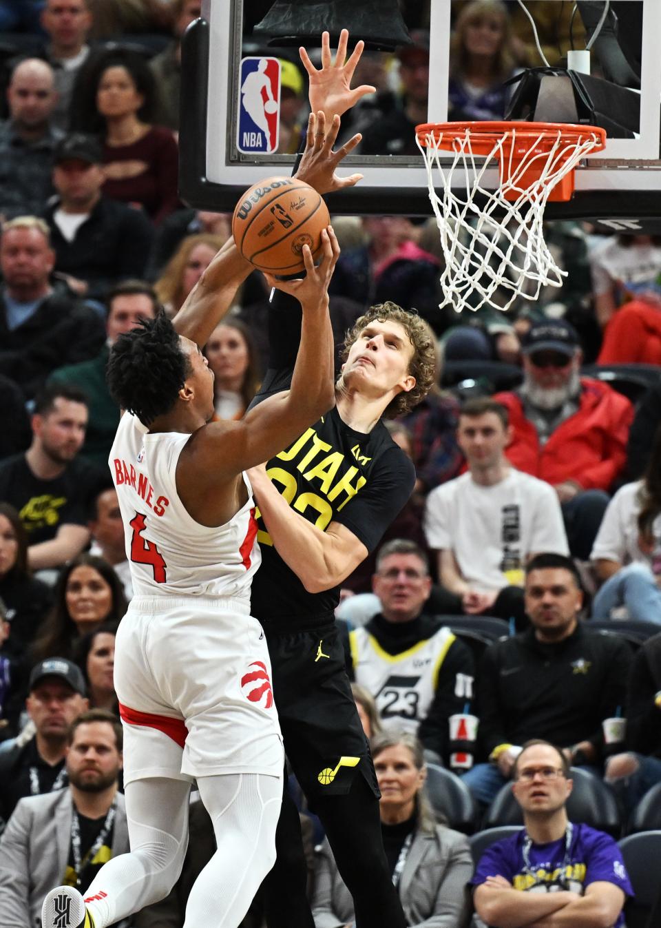 Utah Jazz forward Lauri Markkanen (23) defends Toronto Raptors forward Scottie Barnes (4) as the Jazz and Raptors play at the Delta Center in Salt Lake City on Friday, Jan. 12, 2024. Utah won 145-113.