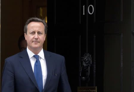 Britain's Prime Minister David Cameron leaves Downing Street to meet his Estonian counterpart Taavi Roivas in London June 18, 2014. REUTERS/Neil Hall