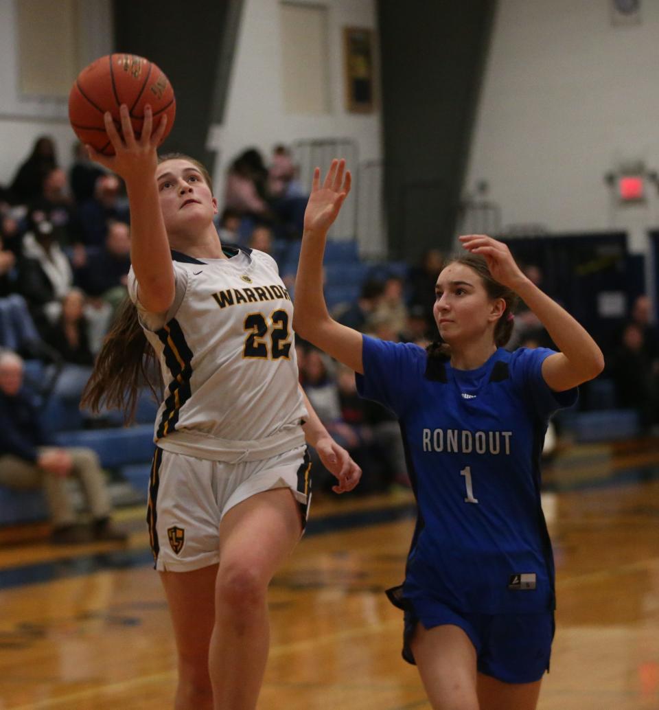 Lourdes' Simone Pelish goes for a layup against Rondout's Helen Molitons during a game on January 4, 2024.