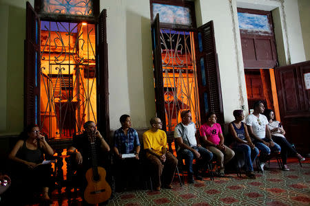 Worshippers and activists supporting the lesbian, gay, bisexual and transgender community (LGBT) attend a service at the Metropolitan Community Church (MCC) in Matanzas, Cuba, October 12, 2018. REUTERS/Alexandre Meneghini