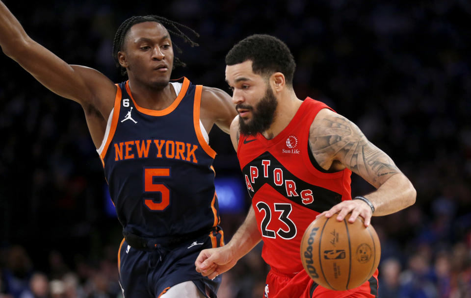 New York Knicks guard Immanuel Quickley (5) defends Toronto Raptors Fred VanVleet (23) during the first half of an NBA basketball game Wednesday, Dec. 21, 2022, in New York. (AP Photo/John Munson)