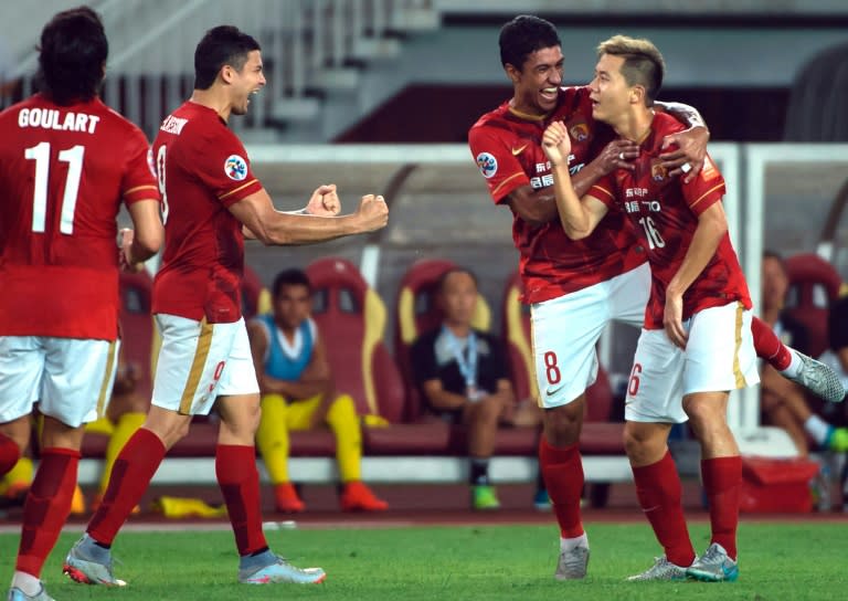 Guangzhou Evergrande's Huang Bowen (R) celebrates with teammates after scoring against Japan's Kashiwa Reysol during their AFC Champions League quarterfinal match at the Tianhe Sport Center in Guangzhou on September 15, 2015