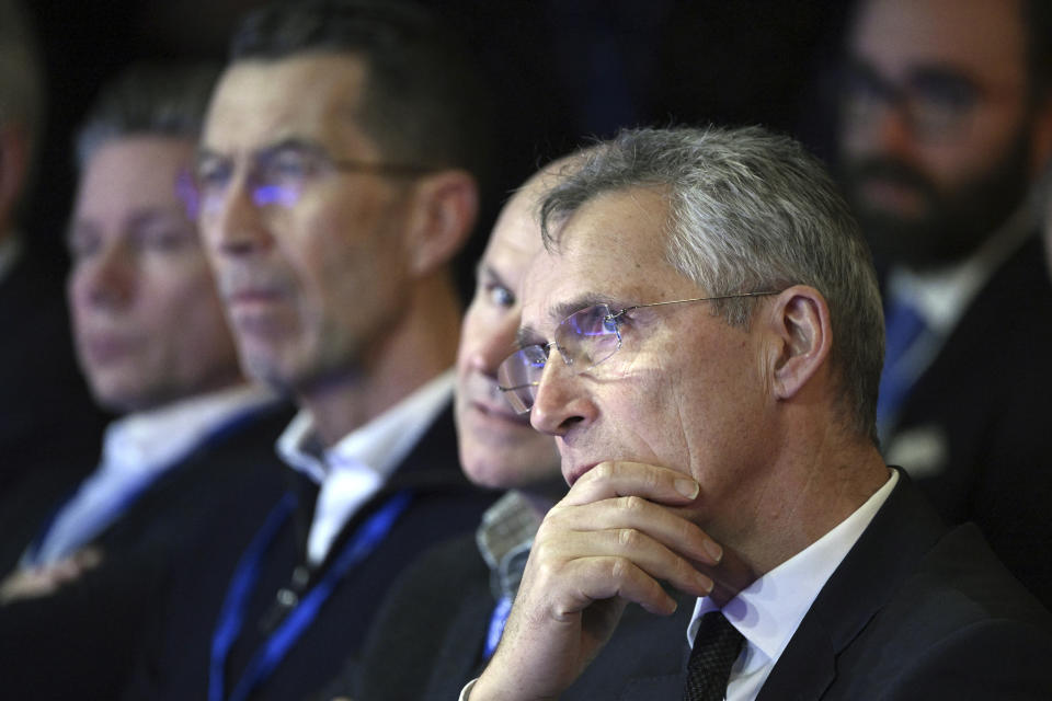 NATO Secretary General Jens Stoltenberg listens to Swedish Prime Minister Ulf Kristersson giving a speech during the annual Society and Defence Conference in Salen, Sweden, Sunday, Jan. 8, 2023. (Henrik Montgomery/TT News Agency via AP)