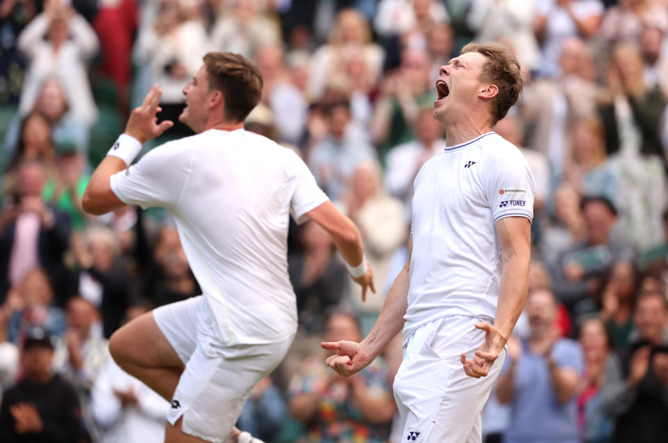 LONDON, ENGLAND - JULY 13: Henry Patten of Great Britain and Harri Heliovaara of Finland celebrate winning Championship point against Max Purcell and Jordan Thompson of Australia in the Gentlemen's Doubles Final during day thirteen of The Championships Wimbledon 2024 at All England Lawn Tennis and Croquet Club on July 13, 2024 in London, England. (Photo by Julian Finney/Getty Images)