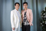 Jung Woo-sung, right, and Lee Jung-jae pose for portrait photographs for the film 'Hunt, at the 75th international film festival, Cannes, southern France, Thursday, May 19, 2022. (Photo by Joel Ryan/Invision/AP)