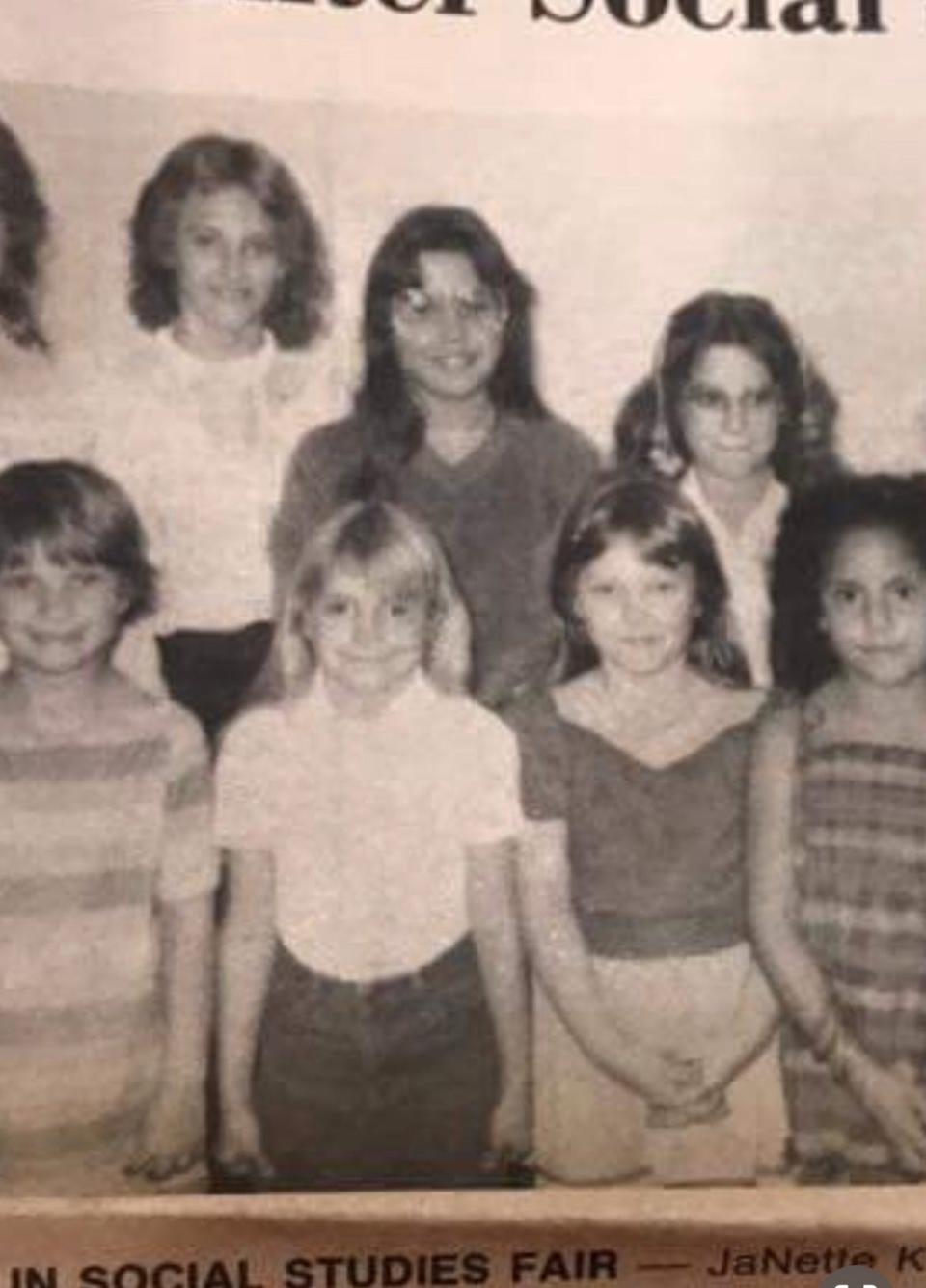 The author, center, wearing glasses with some schoolmates when she was a student at W.F. Burns-Oak Hill Elementary School.