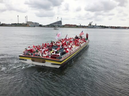 People dressed as Santa Claus take part in the World Santa Claus Congress in Copenhagen