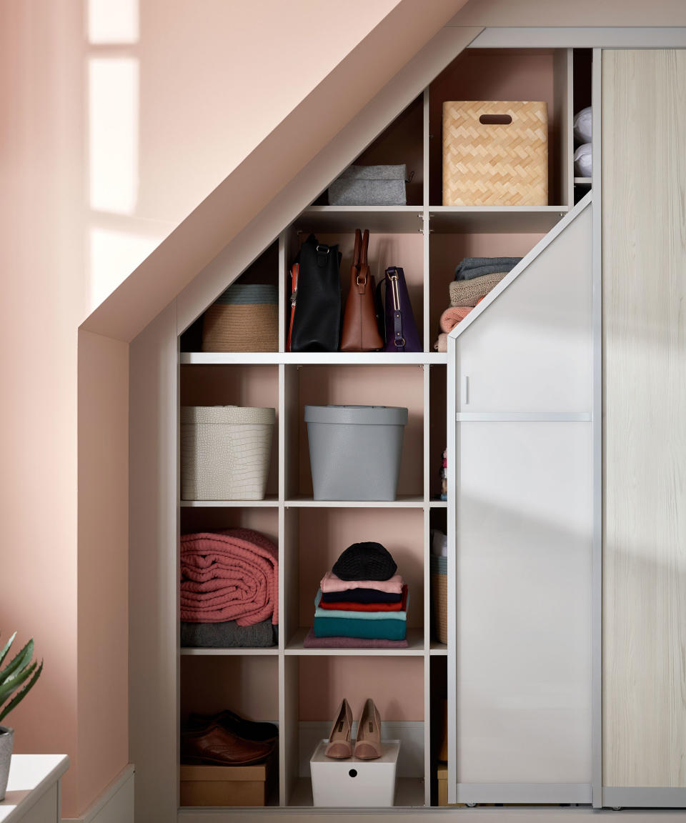 Bespoke wardrobe under eaves with sliding door