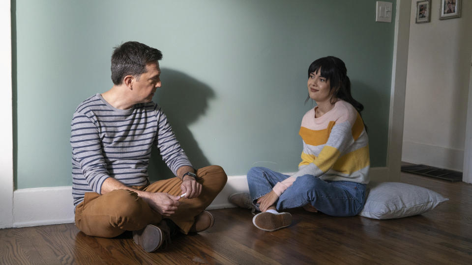 This image released by Bleecker Street shows Ed Helms, left, and Patti Harrison in a scene from "Together Together." (Tiffany Roohani/Bleecker Street via AP)