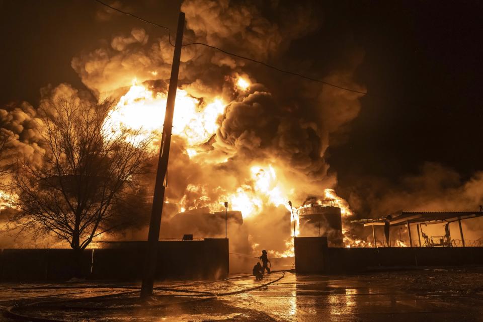 Firefighters extinguish a fire after a Russian attack on a residential neighborhood in Kharkiv, Ukraine Saturday, Feb. 10, 2024. (AP Photo/Yevhen Titov)