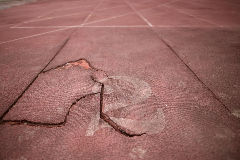 Destroyed tartar running track is seen inside Kosevo Olympic Stadium where the opening ceremony of the Sarajevo Winter Olympic Games took place in Sarajevo, Bosnia, Thursday, Feb. 8, 2024. Sarajevo is paying tribute this week to one of its most glorious moments: the two weeks of February in 1984 when it staged an impeccable Winter Olympic Games. While taking the nostalgic trip down memory lane, Bosnian Olympians say they are looking to the future with hope to again pull off an “apparently impossible feat” and reignite the Olympic flame over Sarajevo in 2032. (AP Photo/Armin Durgut)