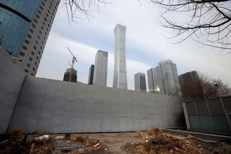 Buildings are seen behind a fence in Beijing's central business area, China January 18, 2019. Picture taken January 18, 2019. REUTERS/Jason Lee