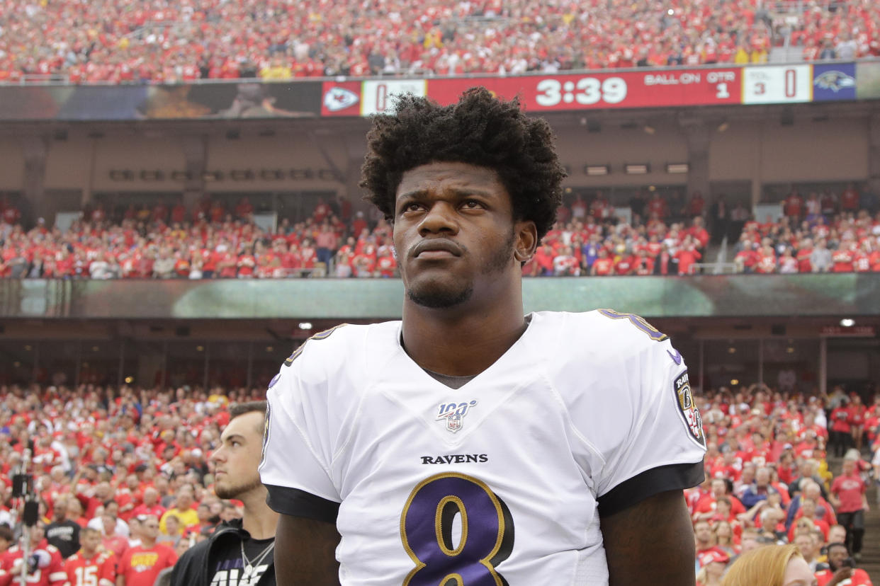 Baltimore Ravens quarterback Lamar Jackson (8) stands for the national anthem before an NFL football game against the Kansas City Chiefs Sunday, Sept. 22, 2019, in Kansas City, Mo. (AP Photo/Charlie Riedel)
