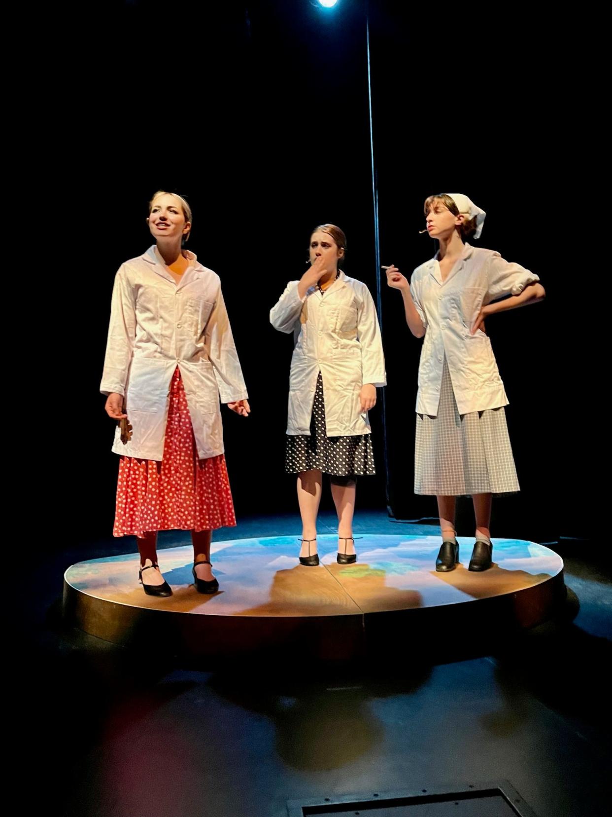 Firestone students Hannah Gippin, from left, Maggie Vollman and Alaina Tennant play women artists from the ink and paint department during the creation of "Snow White and the Seven Dwarfs" in the drama "The Fairest."