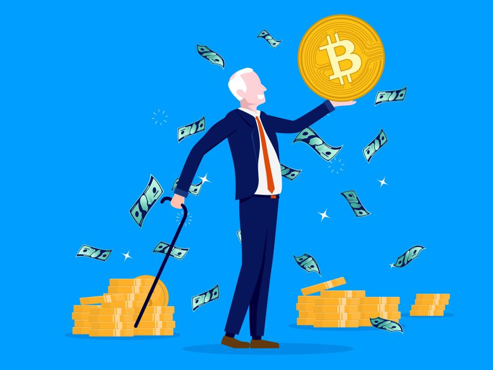 Getty image of older man holding up bitcoin and money