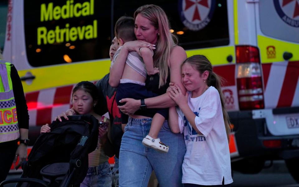 Shocked shoppers flee the scene of the stabbing at the mall