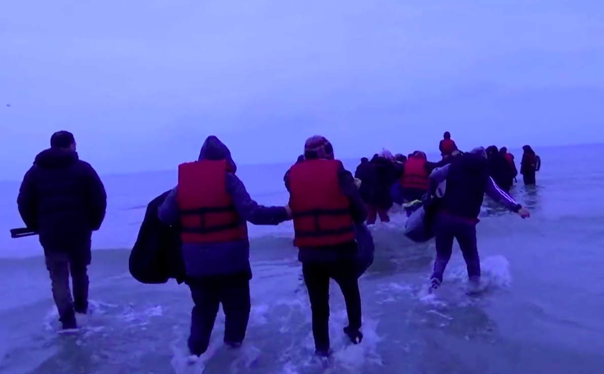 Migrants were filmed entering the dinghy in France on their way to the UK. (Reuters)