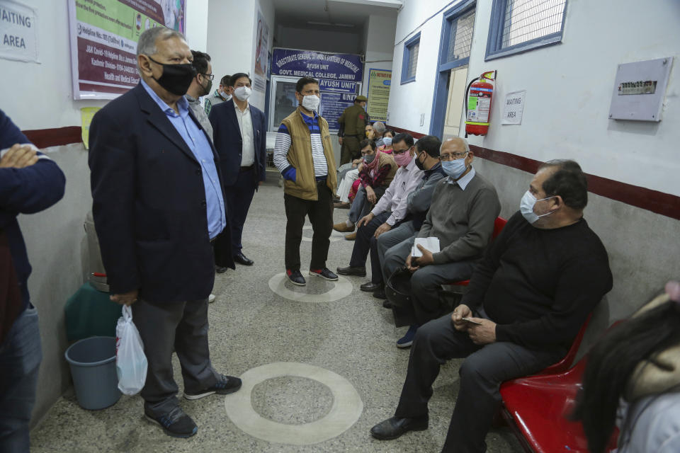 Elderly Indian wait to receive COVID-19 vaccine at the Government Medical College hospital in Jammu, India, Monday, March 1, 2021. India is expanding its COVID-19 vaccination drive beyond health care and front-line workers, offering the shots to older people and those with medical conditions that put them at risk. (AP Photo/Channi Anand)