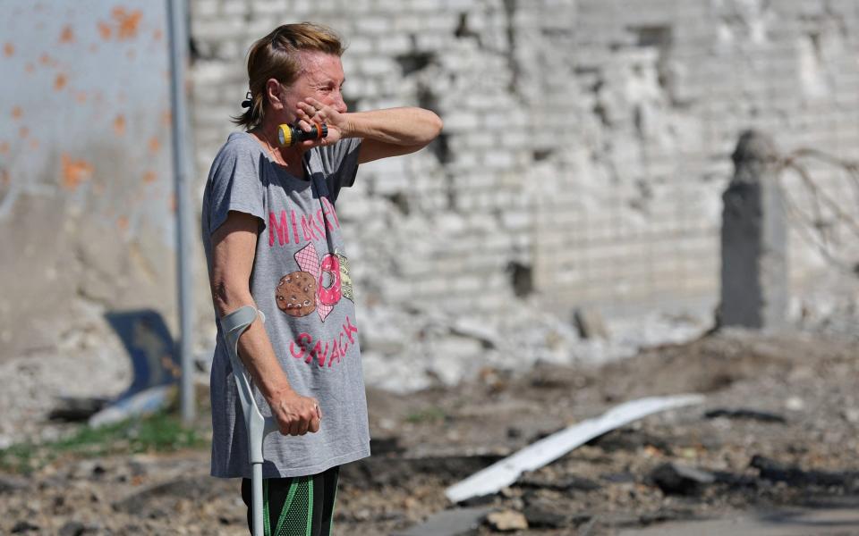 A distraught Ukrainian resident sees the ruins of what was once her home in Sievierodonetsk - ALEXANDER ERMOCHENKO 