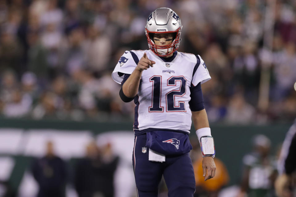 New England Patriots quarterback Tom Brady (12) points to Benjamin Watson (84) after a play during the first half of an NFL football game against the New York Jets, Monday, Oct. 21, 2019, in East Rutherford, N.J. (AP Photo/Adam Hunger)