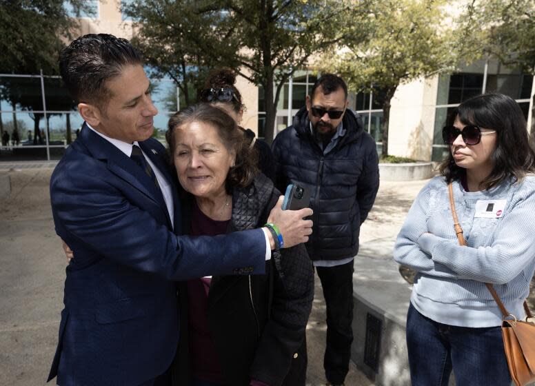 LANCASTER, CA- MARCH 29: Deputy Dist. Atty. Jonathan Hatami hugs Eva Hernandez, Noah Cuatro's great-grandmother following a sentencing hearing at Michael Antonovich Antelope Valley Courthouse in Lancaster, CA on Friday, March 29, 2024. The family felt like justice has been served. Other family members at the hearing were Maggie Hernandez, right, great-aunt; Matthew Hernandez, great-uncle, and family friend Crystal Wright, rear left. Noah Cuatro was tortured and killed in 2019. The parents Jose Cuatro and Ursula Juarez pleaded no contest. (Myung J. Chun / Los Angeles Times)