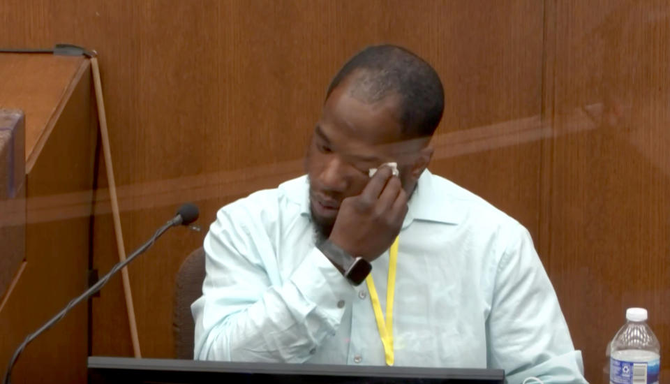 Donald Williams wipes away tears as he testifies in the Derek Chauvin trial in Minneapolis on Tuesday. (Via Reuters Video)