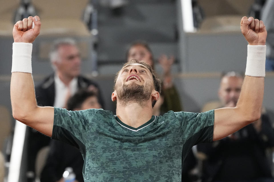 Norway's Casper Ruud celebrates after defeating Croatia's Marin Cilic during their semifinal of the French Open tennis tournament at the Roland Garros stadium Friday, June 3, 2022 in Paris. Ruud won 3-6, 6-4, 6-2, 6-2. (AP Photo/Michel Euler)