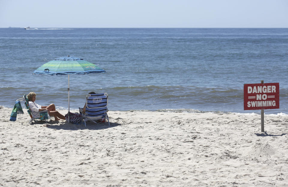 A sign near Ocean Beach on Fire Island, N.Y., in 2018 following a pair of reported shark attacks.