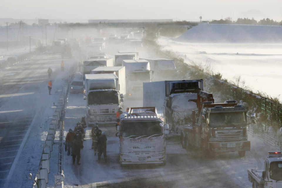 Cars are stuck on the snowy Tohoku Expressway in Osaki, Miyagi prefecture, northern Japan, after a multiple accident, Tuesday, Jan. 19. 2021. (Yusuke Ogata/Kyodo News via AP)