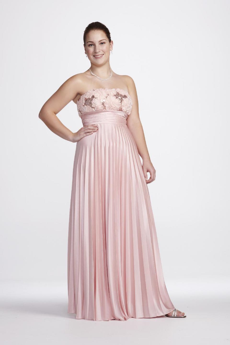 This undated image released by David's Bridal shows a popular prom gown design offered at David's Bridal. Clothes shopping for plus-size teens can be frustrating in general, but shopping for a dream prom dress can be a tear-inducing, hair-pulling morass of bad design and few options _ especially for girls who want a dress that hugs the body instead of tenting it. (AP Photo/David's Bridal)