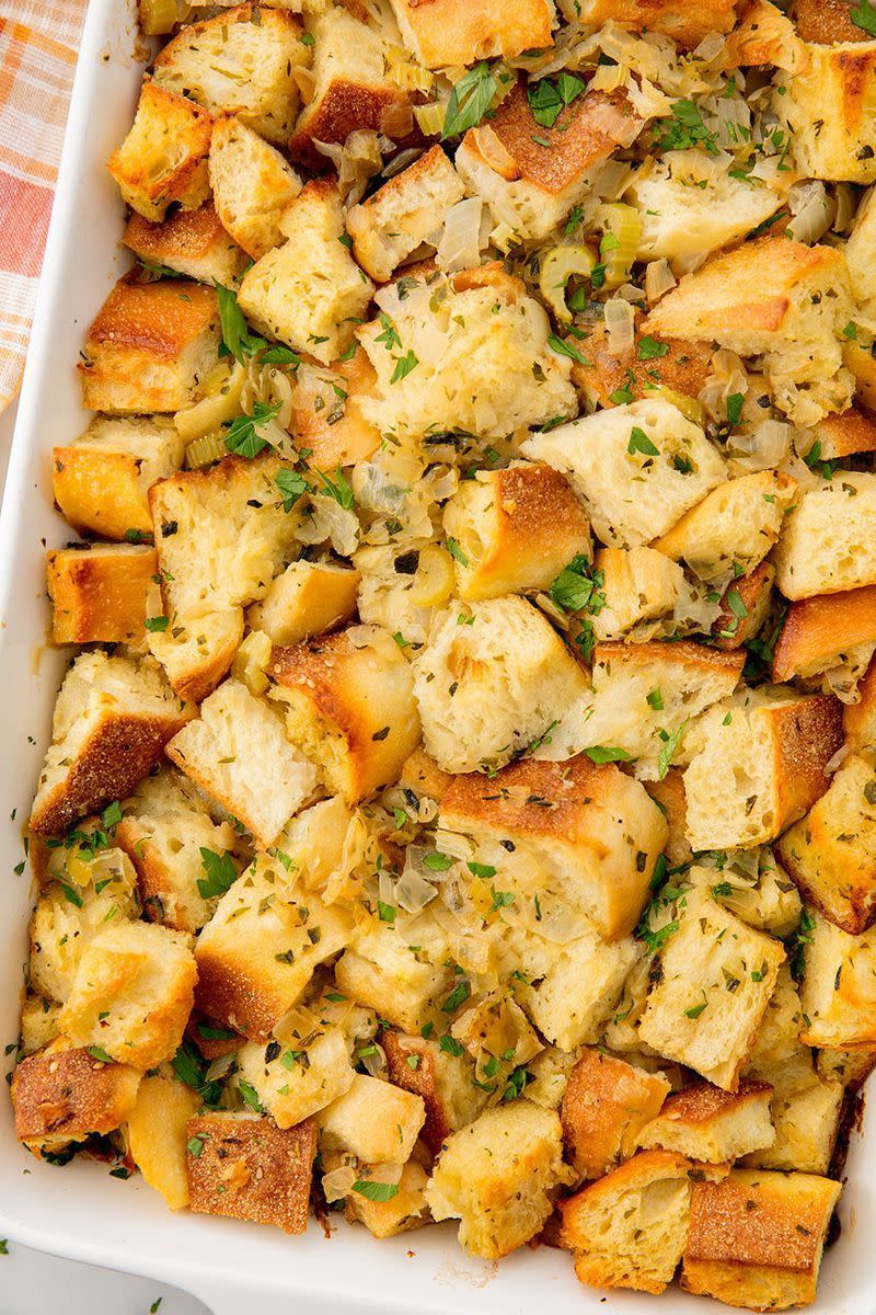<p>At its simplest, stuffing is a seasoned bread cube mixture of onion and herbs. Traditionally, it's stuffed inside the bird, but we prefer to bake ours in a separate baking dish.</p><p>Get the <a href="https://www.delish.com/uk/cooking/recipes/a30376943/classic-homemade-turkey-stuffing-recipe/" rel="nofollow noopener" target="_blank" data-ylk="slk:Classic Stuffing;elm:context_link;itc:0;sec:content-canvas" class="link ">Classic Stuffing</a> recipe.</p>