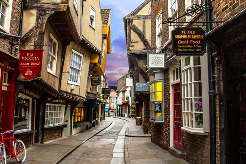 The Shambles is an old street in York with overhanging timber-framed buildings, some dating back as far as the 14th century