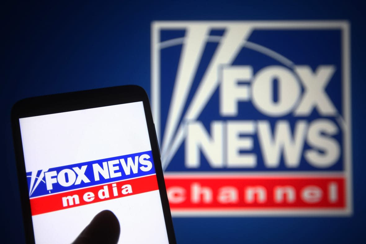 In this photo illustration a Fox News Channel (FNC) logo is seen on a smartphone and a pc screen. (Photo Illustration by Pavlo Gonchar/SOPA Images/LightRocket via Getty Images)