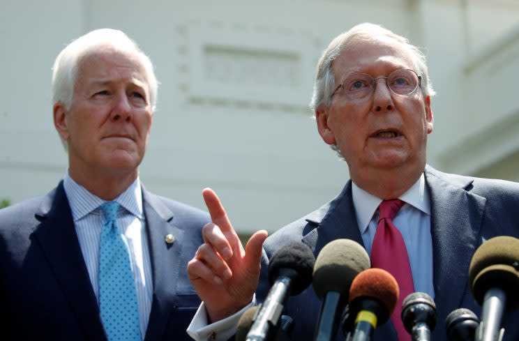 Senate Majority Whip John Cornyn and Senate Majority Leader Mitch McConnnell speak to reporters after meeting with the president to discuss health care on July 19. (Photo: Kevin Lamarque/Reuters)