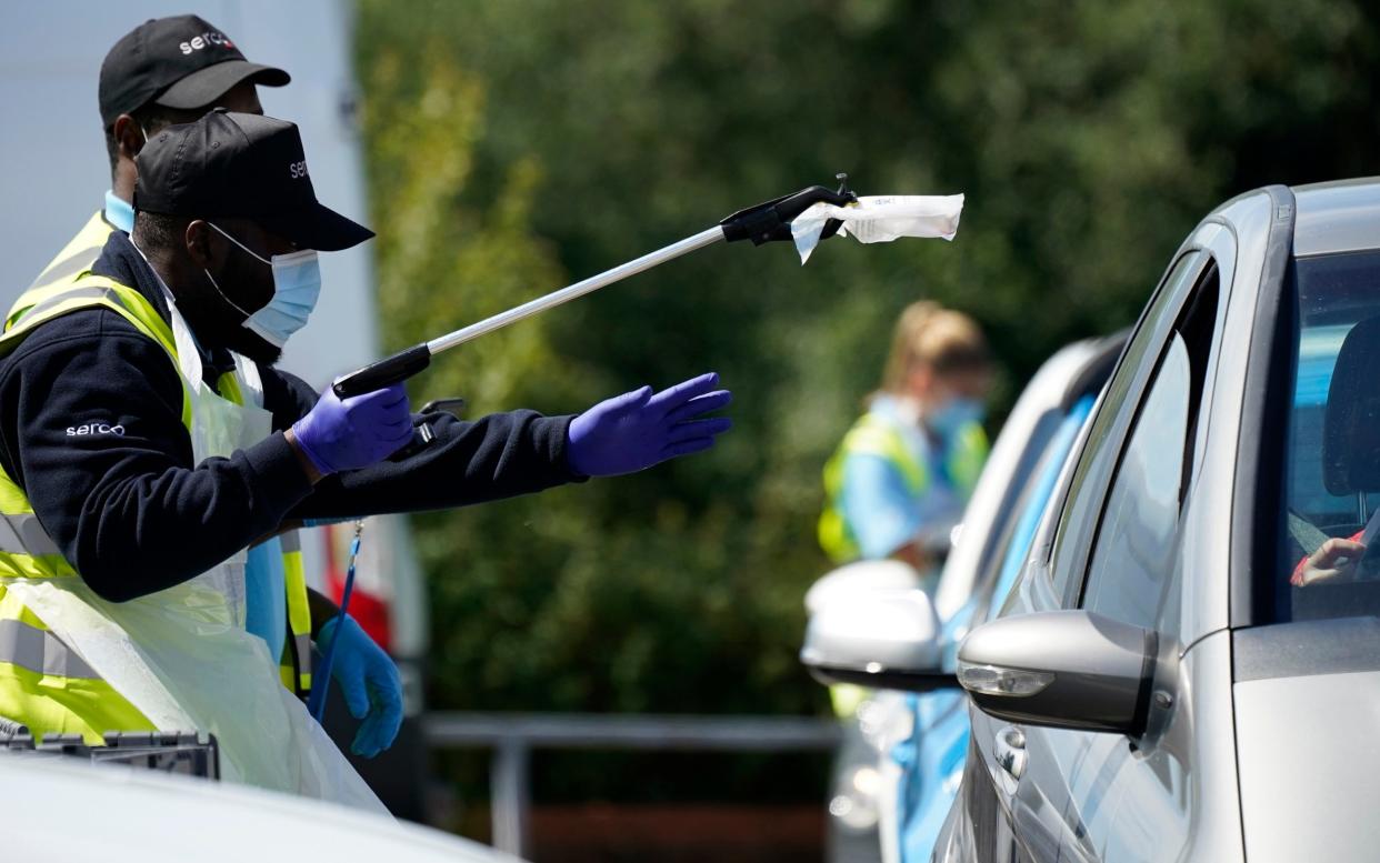 A coronavirus test is carried out at a drive-through testing centre in Stone, Staffordshire - Christopher Furlong/Getty Images Europe