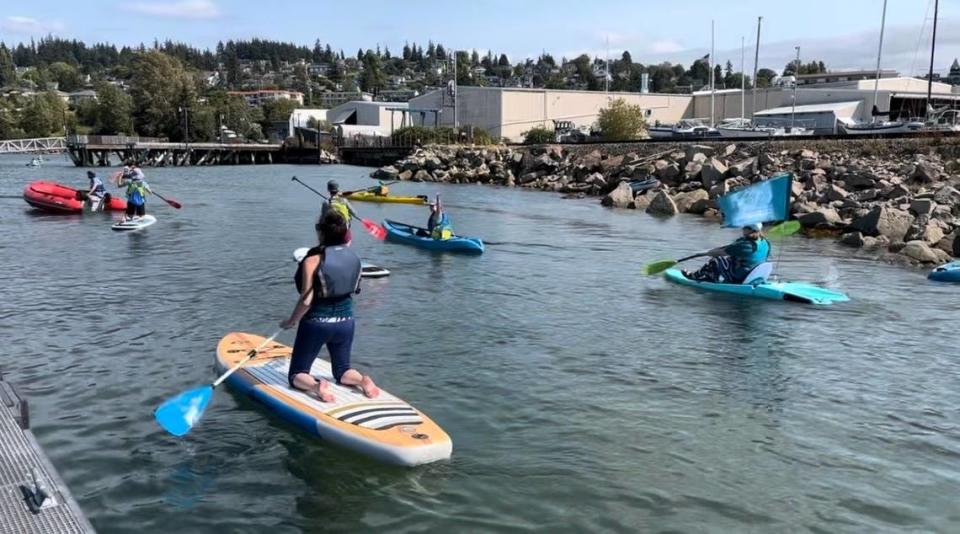 Members of the ovarian cancer community gathered on Sept. 3, 2022, for the first-ever ‘Ride the Teal Wave’ paddle fundraiser event in Bellingham Bay. The group will gather for its second annual fundraiser event on Sept. 3, 2023.