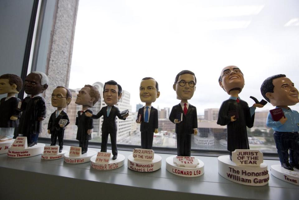 A collection of bobblehead figurines in the likeness of judges who have won the Jurist of the Year award inside the office of the Texas Solicitor General on Sept. 14, 2018.