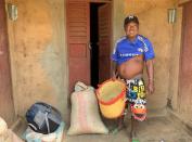 Randriamampionina, farmer and coffee grower in Amparaky village, carries his basket as he prepares for his first cafŽ bourbon harvest in Ampefy town of Itasy region