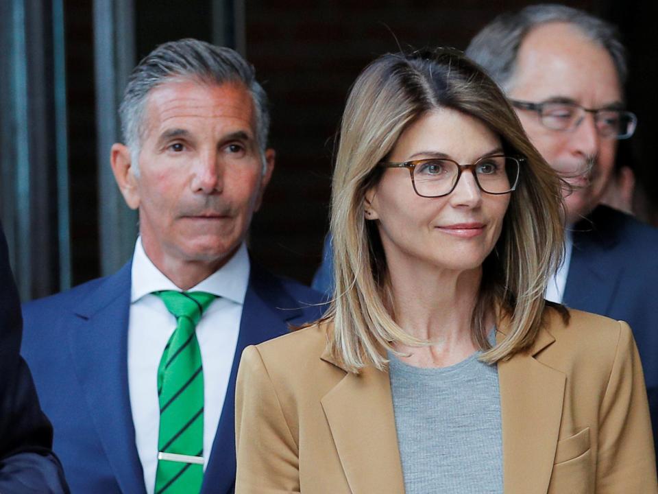 Actor Lori Loughlin, and her husband, fashion designer Mossimo Giannulli, leave the federal courthouse after facing charges in a nationwide college admissions cheating scheme, in Boston, Massachusetts,.JPG