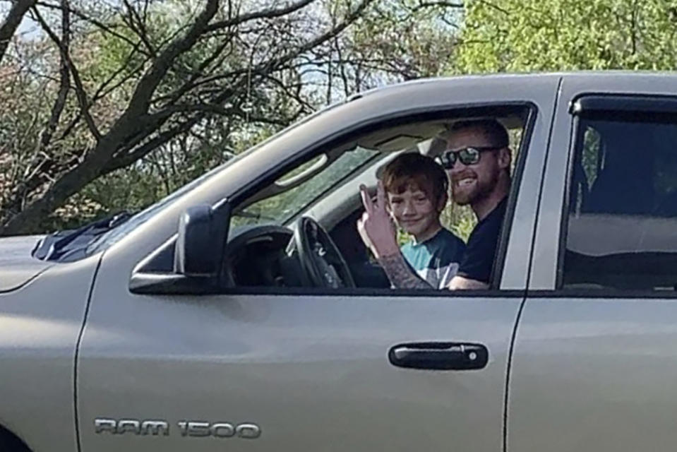 This undated photo provided by the family of Matt Jones shows him and his nephew at his brother's house in Culpeper, Va. Jones, a 36-year-old man from West Virginia, was apparently suffering from a severe manic episode on July 6, 2022, while standing on a highway Bradley, W.Va., with a handgun. The scene was captured by a bystander on video. One officer took a shot and then others opened fire, killing Jones in a hail of bullets. Jones had been unable to get his medication refilled and was experiencing delusions and hallucinations, his fiancée said. (Family of Matt Jones via AP)